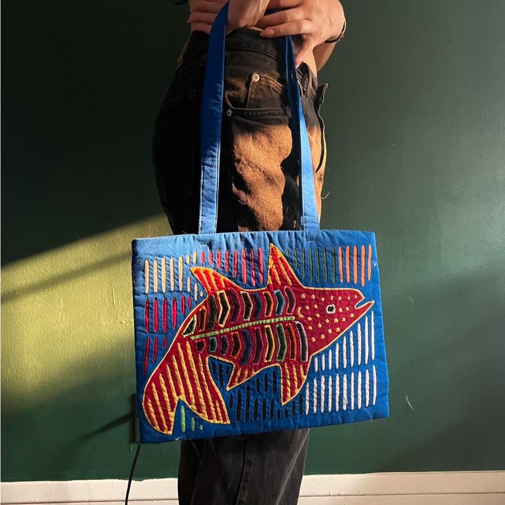 Blue bag with multicolored patchwork of a fish